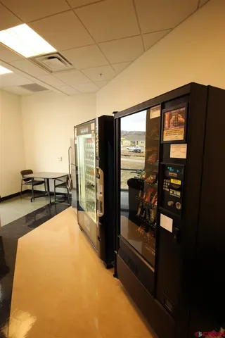 a view of a hallway with a room