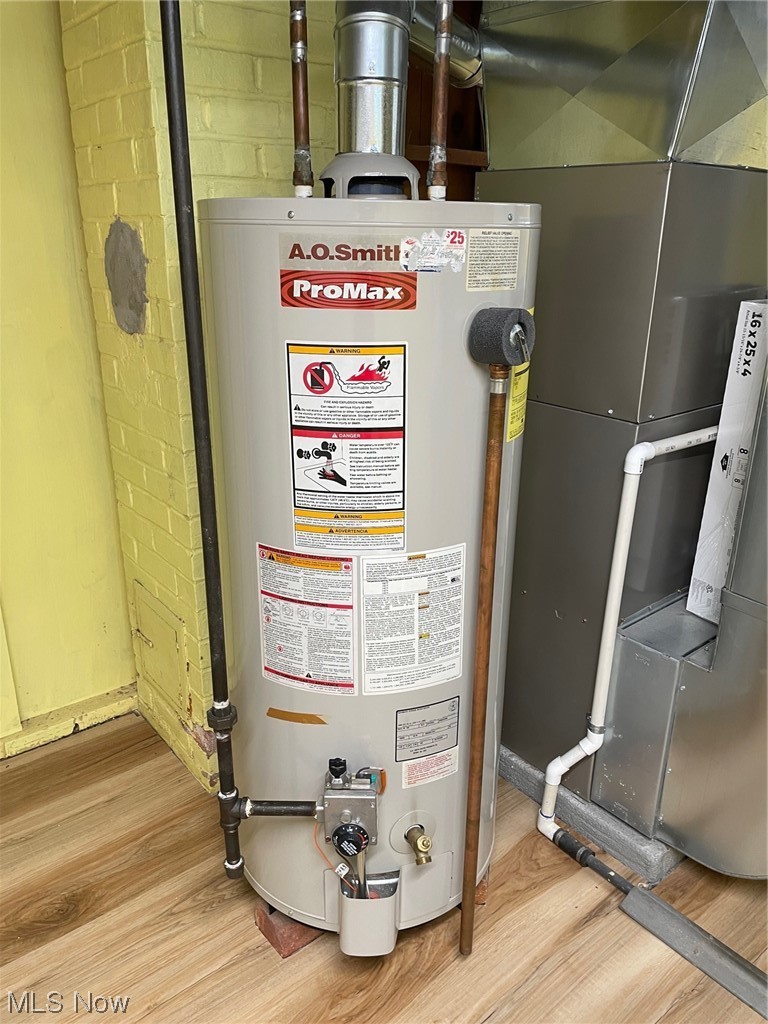 5972 Crossview Road Independence, OH 44131 - Photo 24 of 33 Utility room featuring gas water heater
