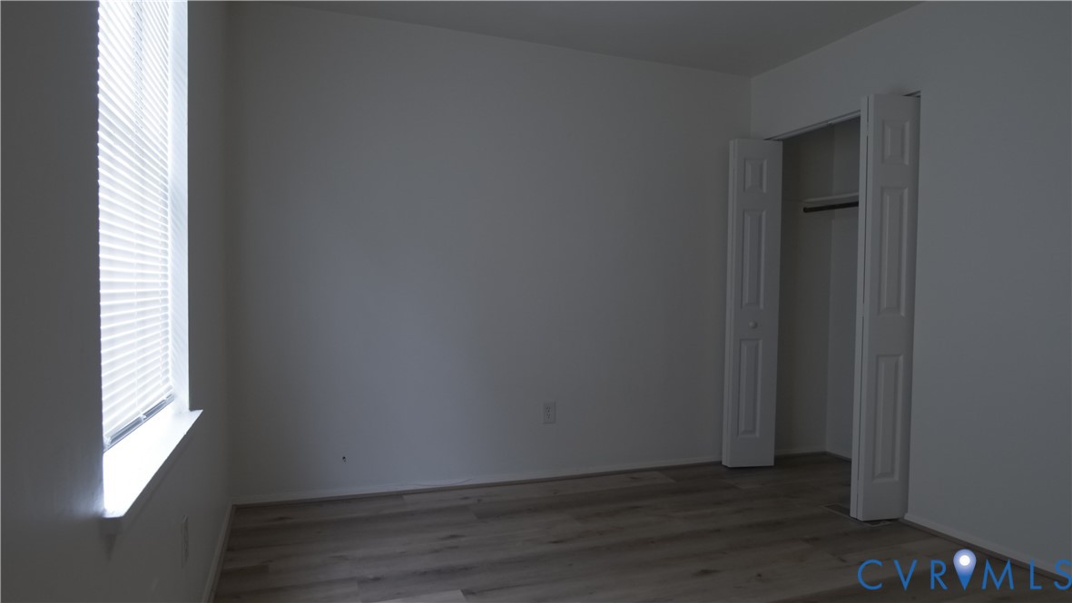 419 Roxana Road Henrico, VA 23075 - Photo 36 of 56 a view of an empty room with wooden floor and a window