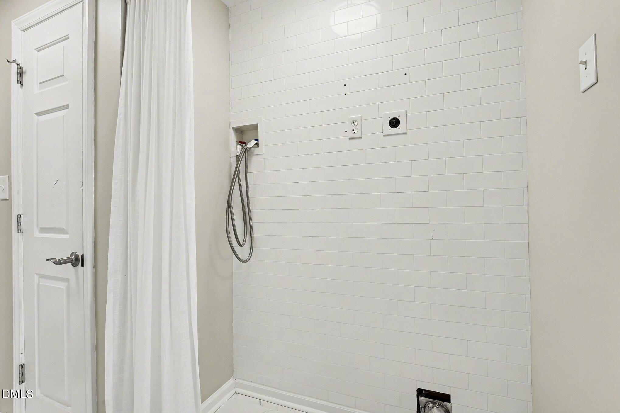2125 Cheek Road Durham, NC 27704 - Photo 17 of 24 a bathroom with a glass shower door