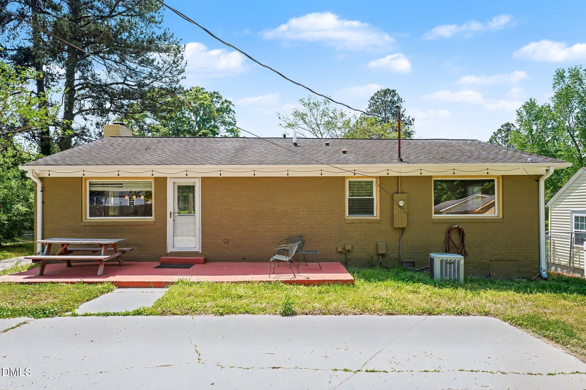 2125 Cheek Road Durham, NC 27704 - Photo 23 of 24 a front view of a house with a yard