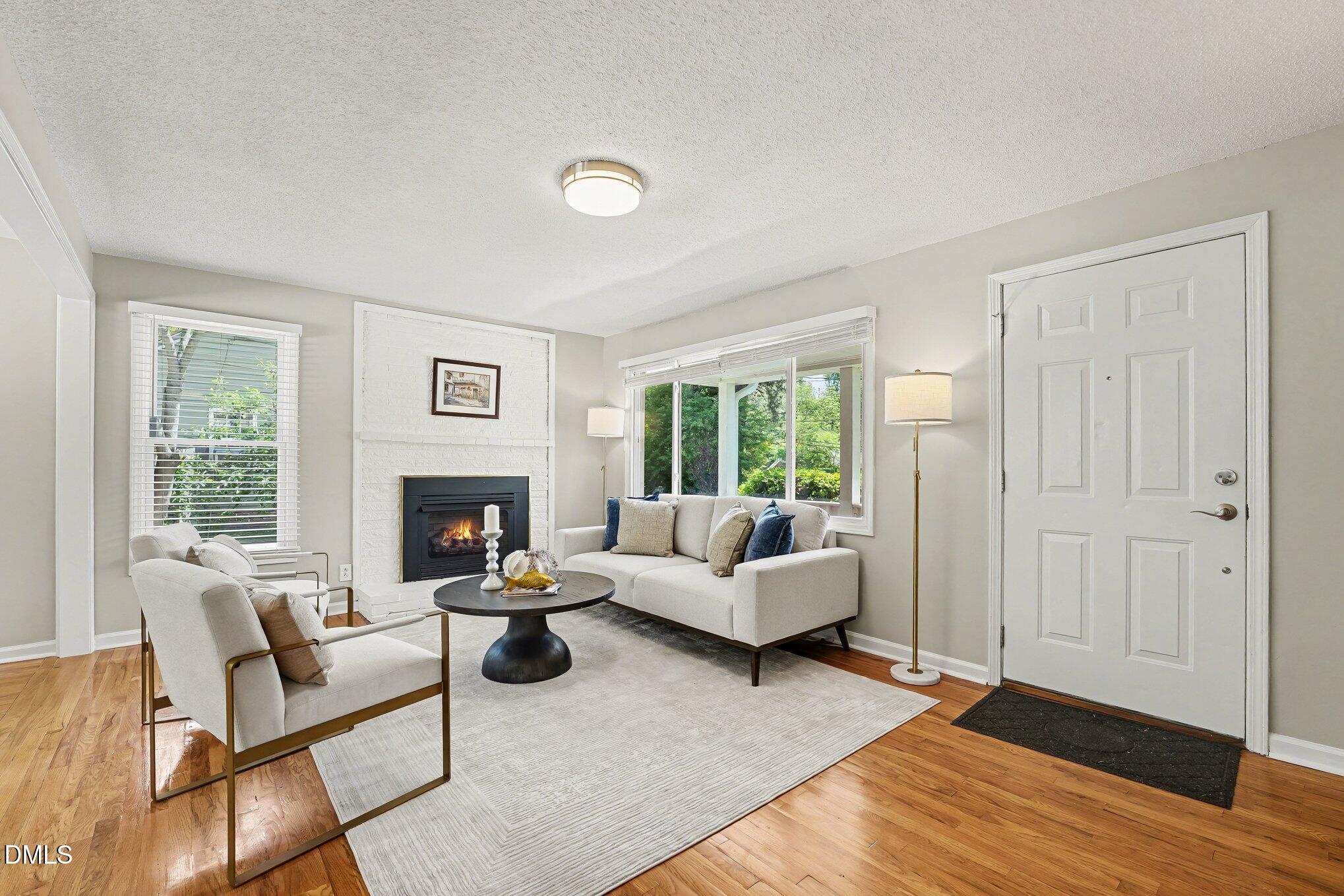 2125 Cheek Road Durham, NC 27704 - Photo 5 of 24 a living room with furniture and a fireplace