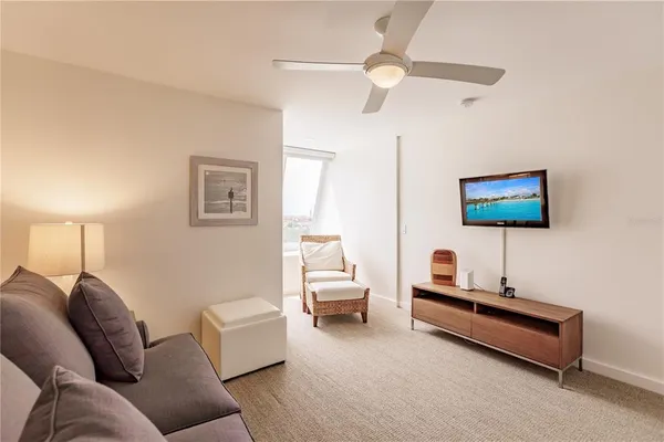 a living room with furniture and a lamp