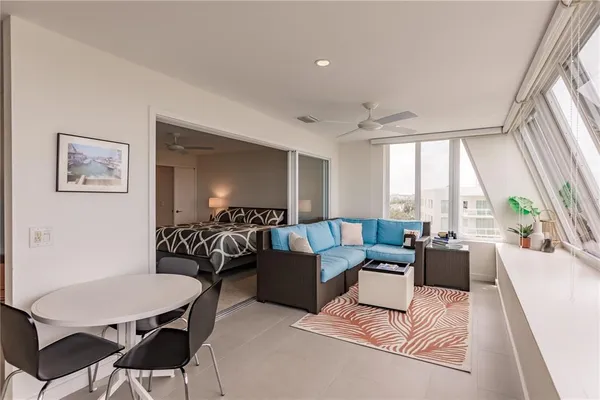 a living room with furniture and a large window