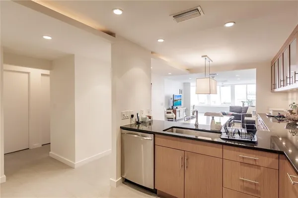 a kitchen with counter top space and sink