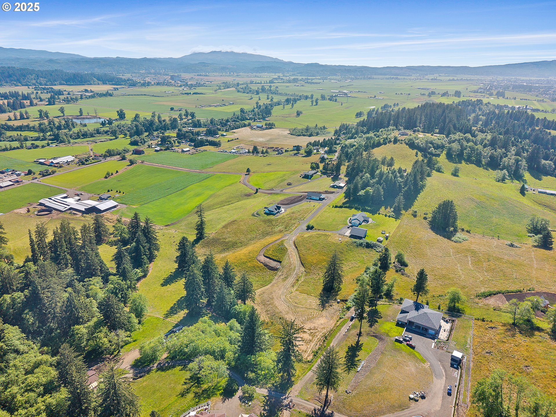 Edelwyss Road, Unit 405 Tillamook, OR 97141 - Photo 5 of 12 a view of a city with mountains in the background