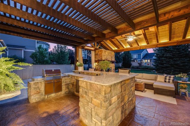 a view of a patio with table and chairs with wooden floor