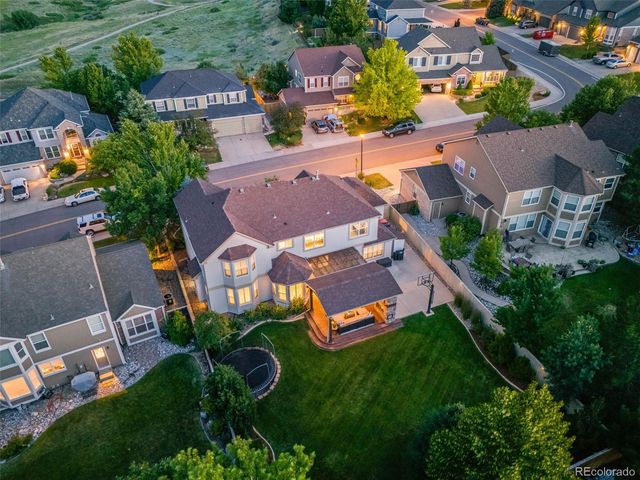 an aerial view of a house with a garden
