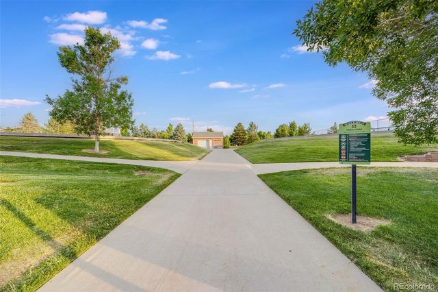 a view of a golf course with a garden