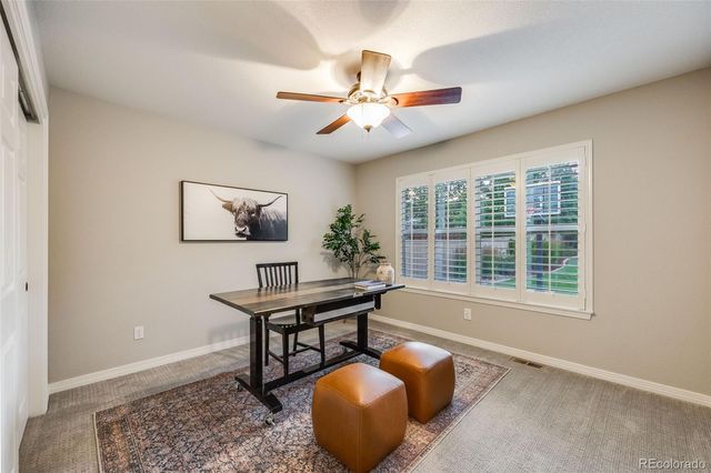 a workspace with furniture and window