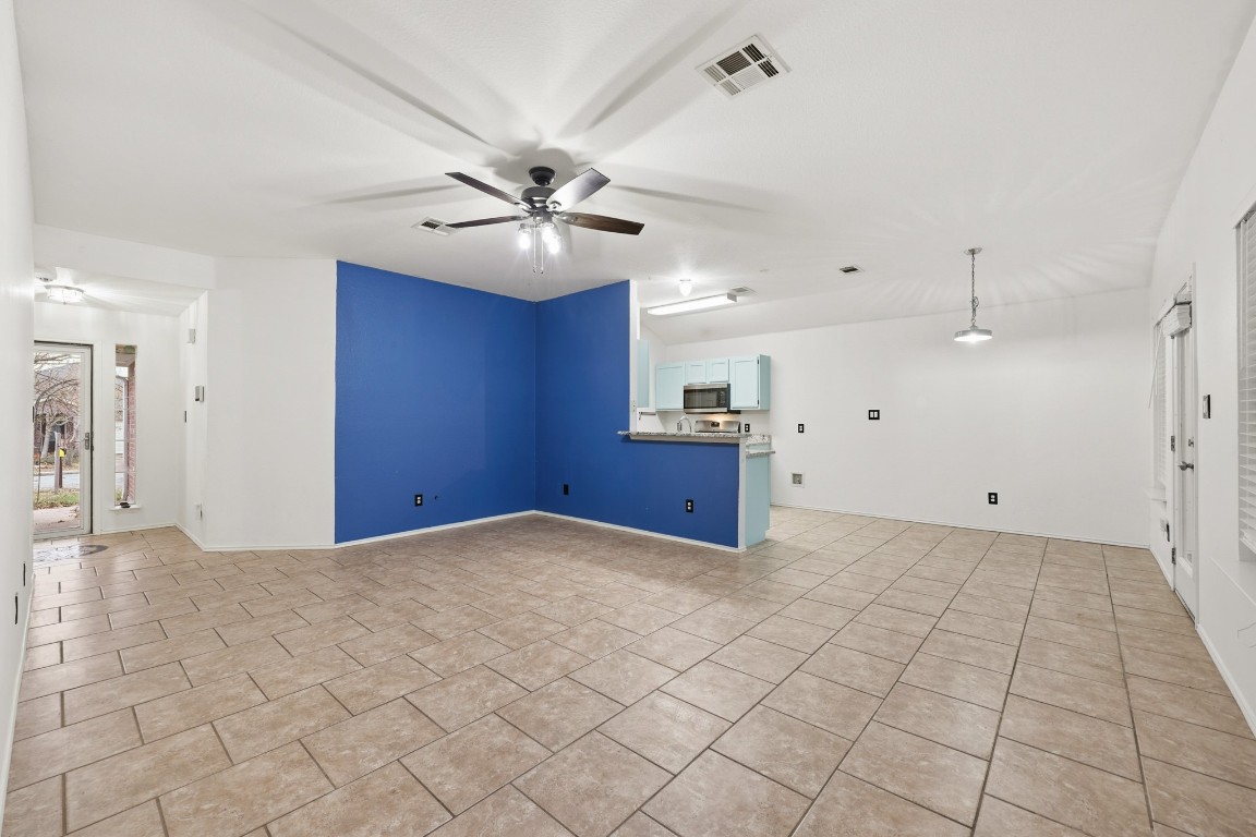 125 Blue Ridge Trail Elgin, TX 78621 - Photo 11 of 27 Empty room featuring ceiling fan