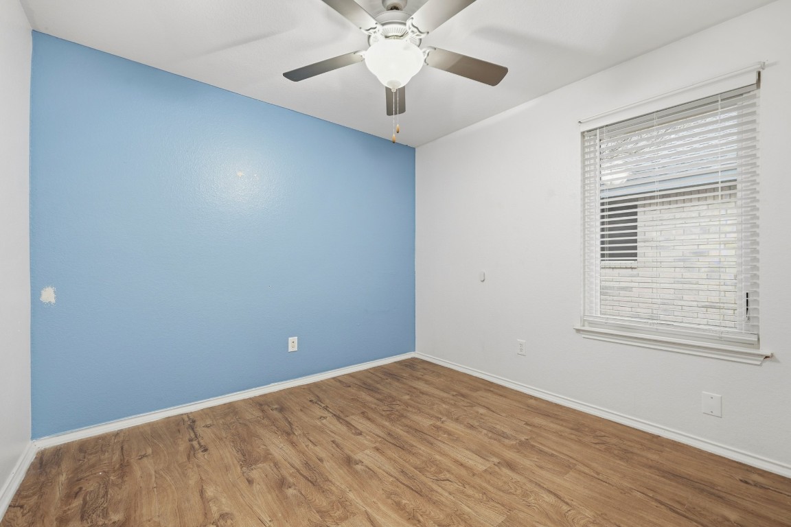125 Blue Ridge Trail Elgin, TX 78621 - Photo 18 of 27 Bedroom with wood finished floors