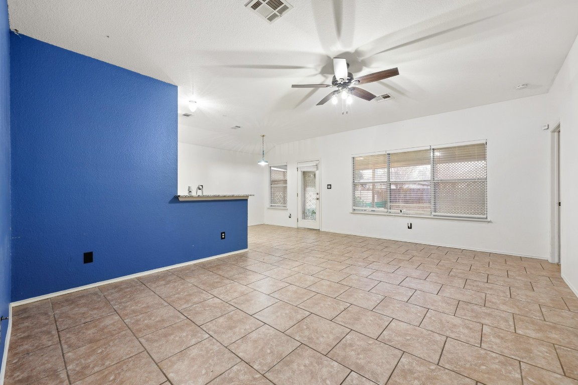 125 Blue Ridge Trail Elgin, TX 78621 - Photo 10 of 27 Spare room featuring ceiling fan and light tile patterned floors