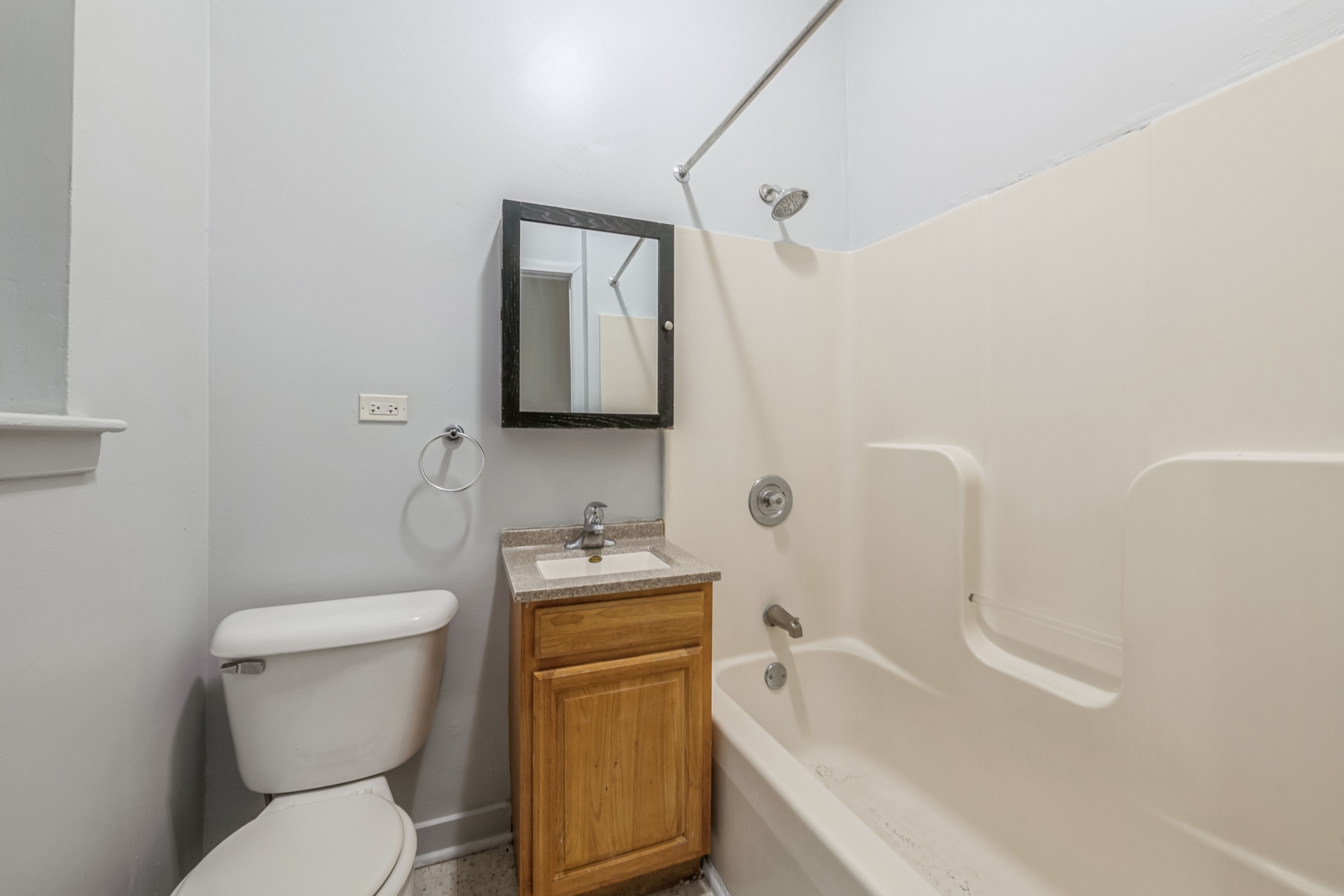 308 North Kedzie Avenue, Unit 1 Chicago, IL 60624 - Photo 6 of 11 a white toilet sitting next to a bathroom sink and tub