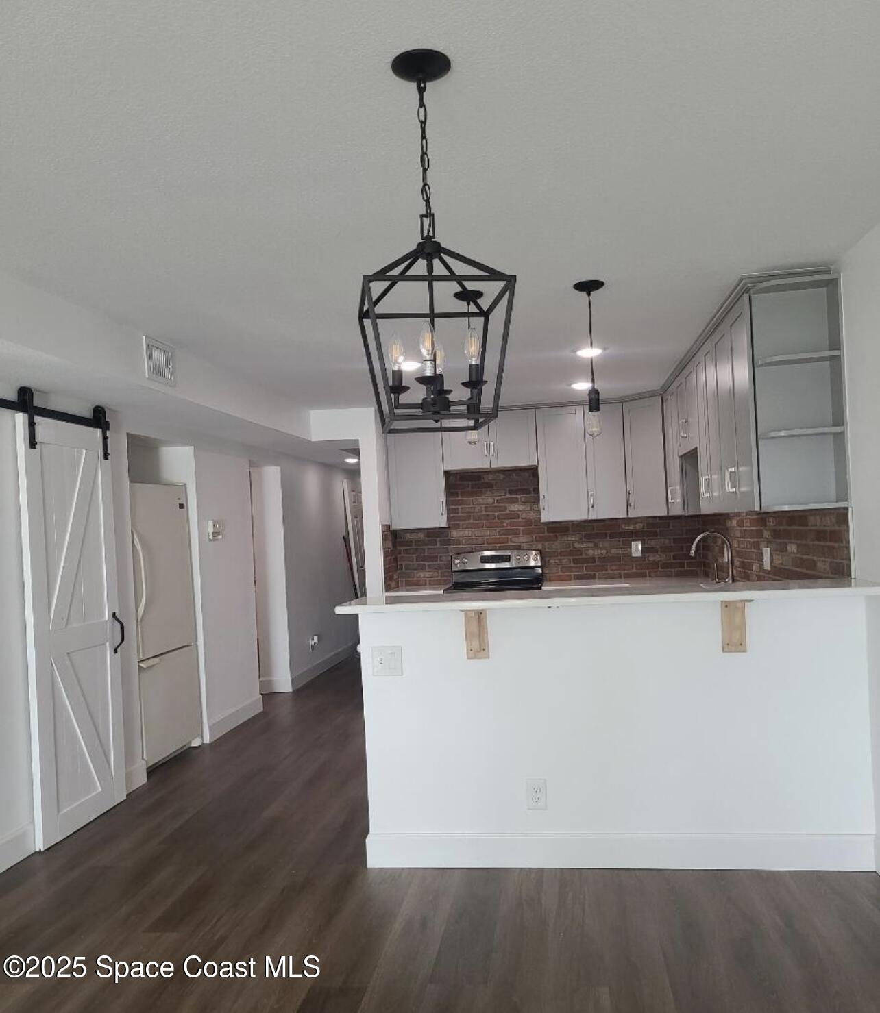 760 South Brevard Avenue, Unit 416 Cocoa Beach, FL 32931 - Photo 4 of 28 IMG_1242