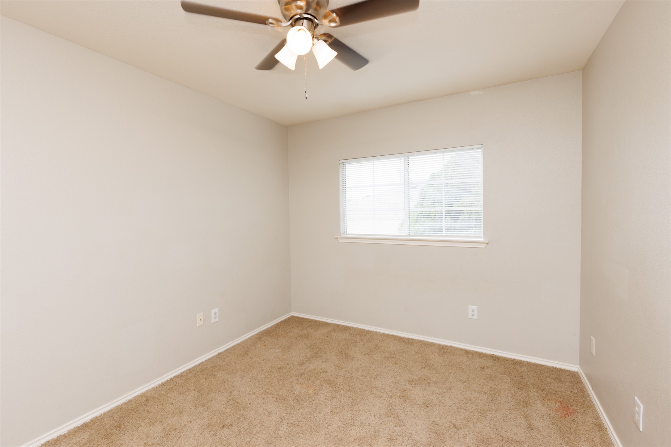 1101 Sheltie Lane Round Rock, TX 78664 - Photo 17 of 22 an empty room with a window and a fan