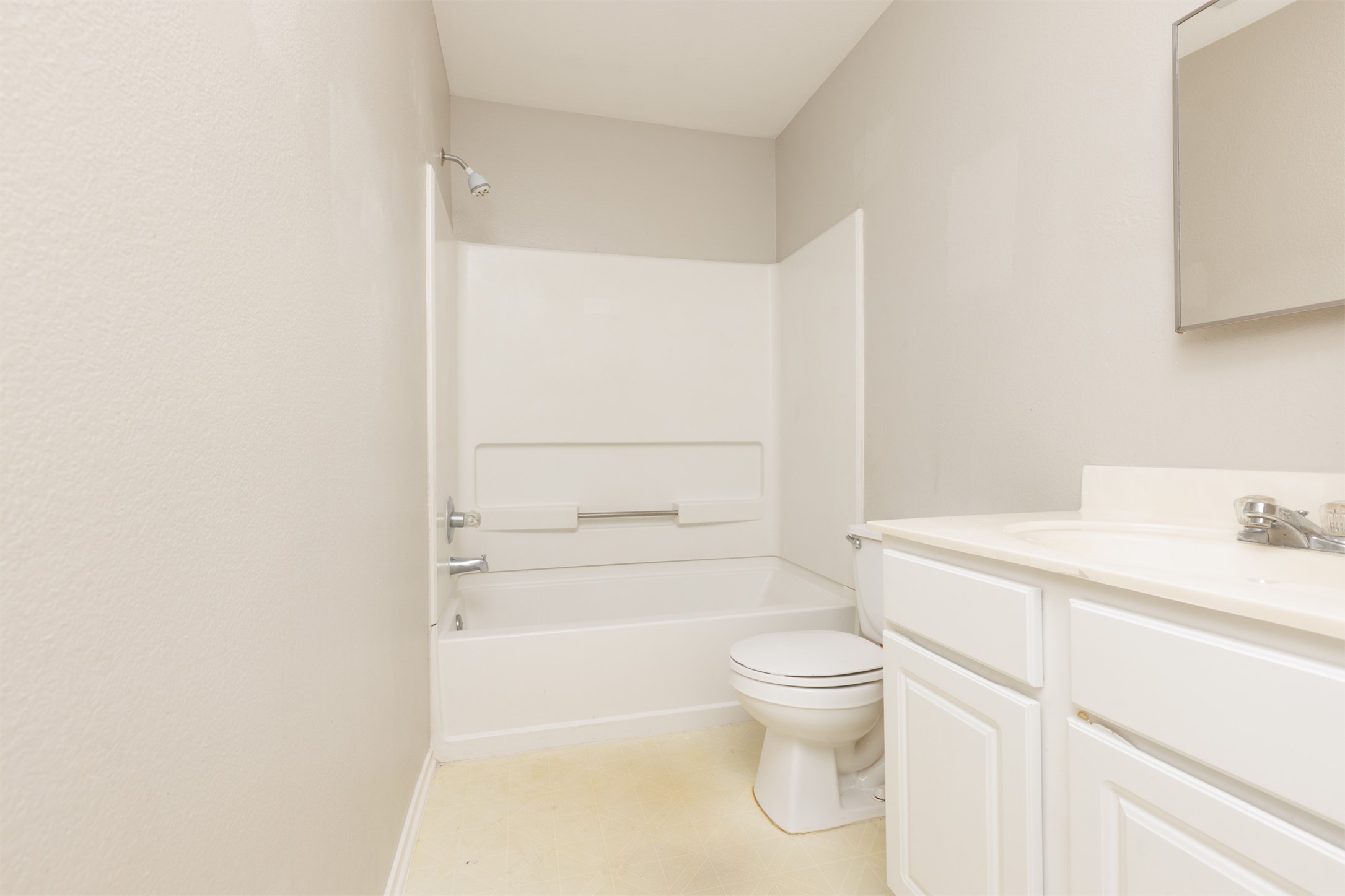 1101 Sheltie Lane Round Rock, TX 78664 - Photo 21 of 22 a bathroom with a granite countertop sink a toilet and a shower
