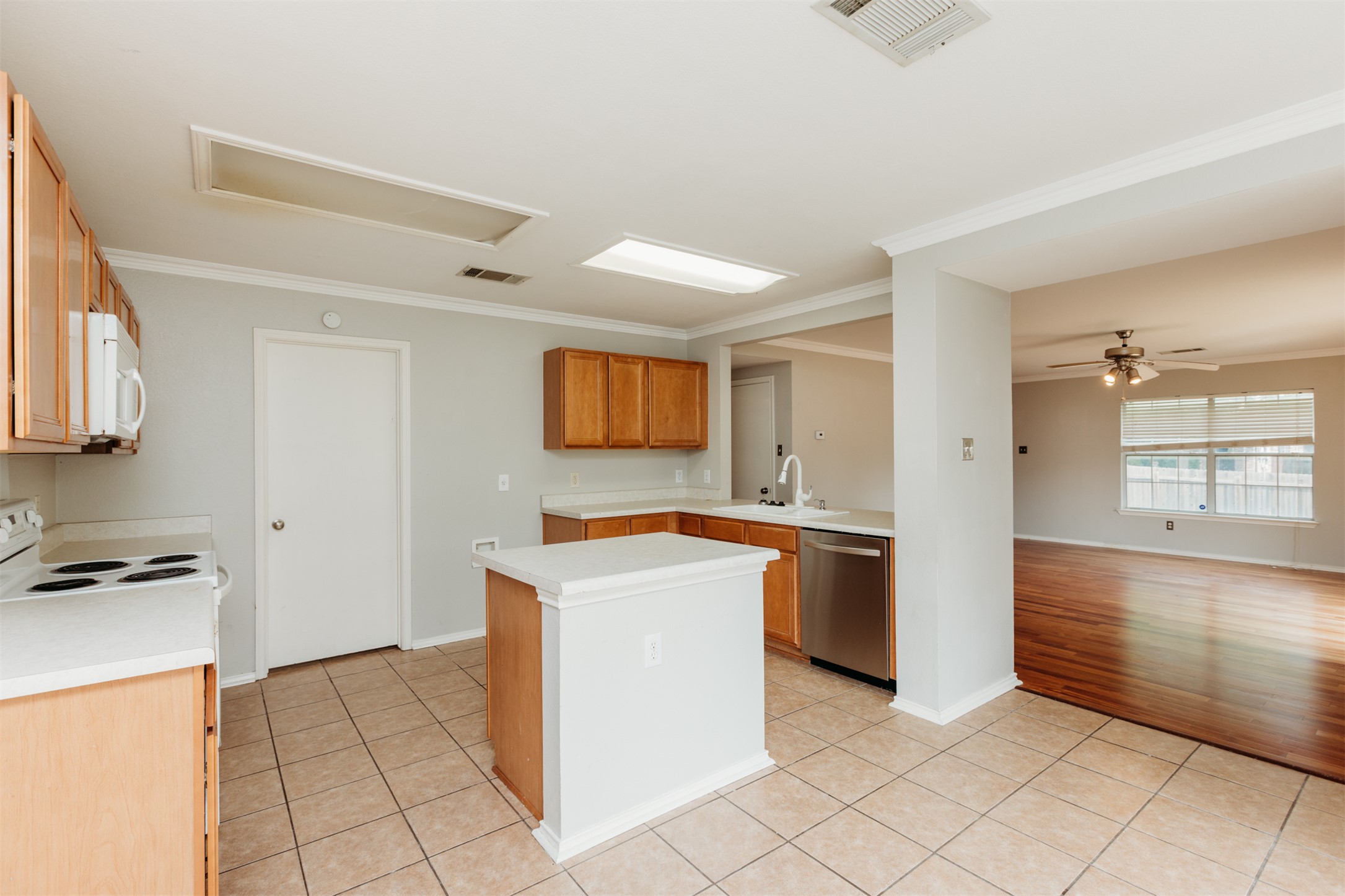 1101 Sheltie Lane Round Rock, TX 78664 - Photo 6 of 22 a kitchen with stainless steel appliances a stove a sink and a refrigerator