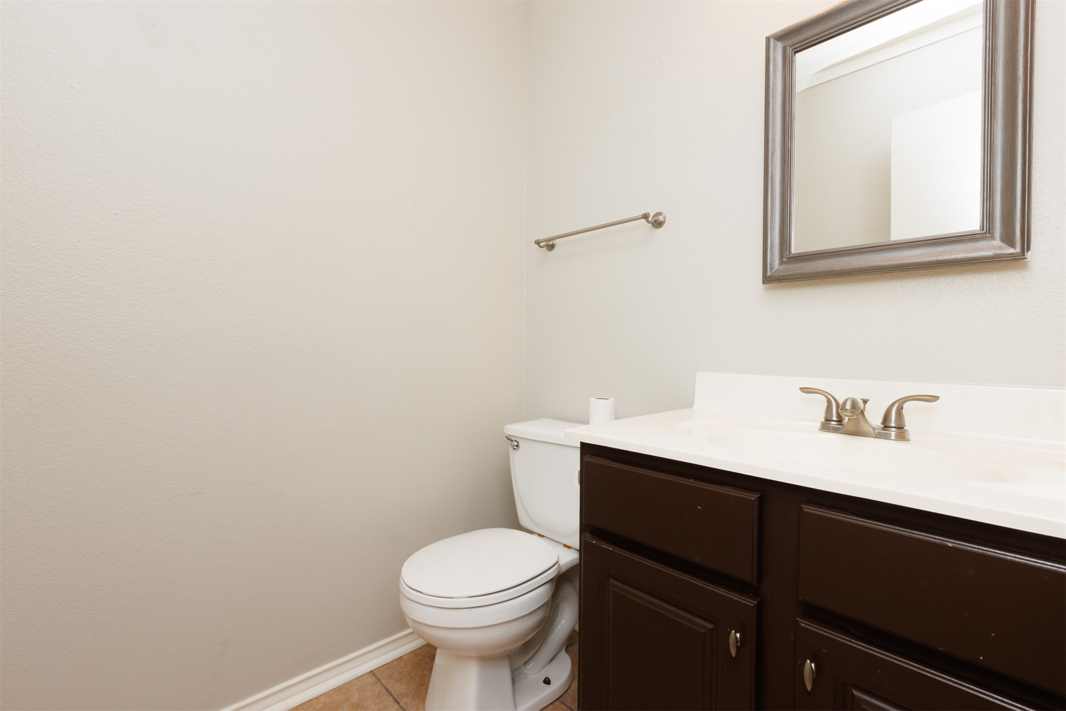 1101 Sheltie Lane Round Rock, TX 78664 - Photo 10 of 22 a bathroom with a sink vanity and toilet