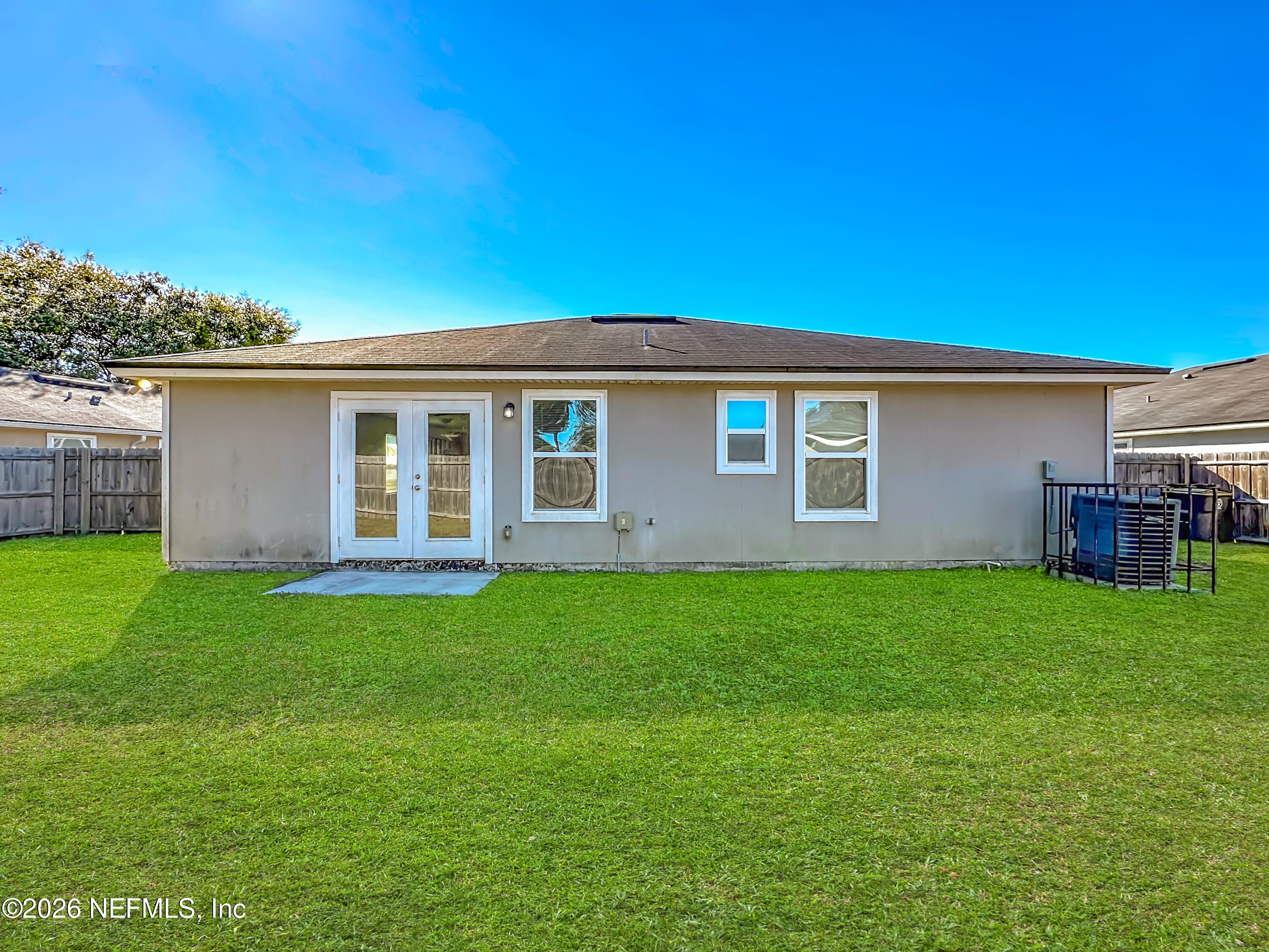 9487 Thorn Glen Road Jacksonville, FL 32208 - Photo 19 of 19 a view of a house with a backyard