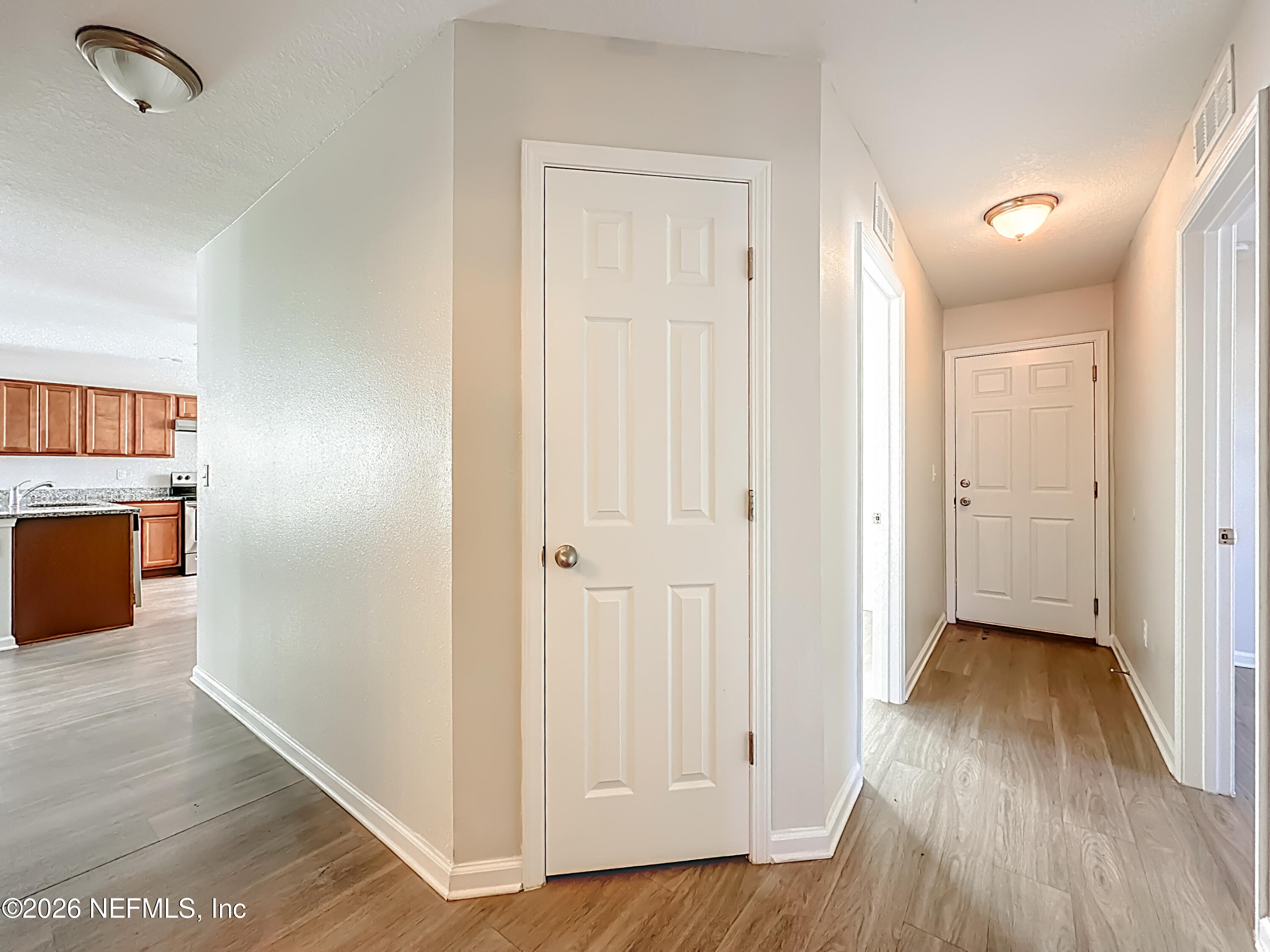 9487 Thorn Glen Road Jacksonville, FL 32208 - Photo 8 of 19 a view of a hallway with wooden floor