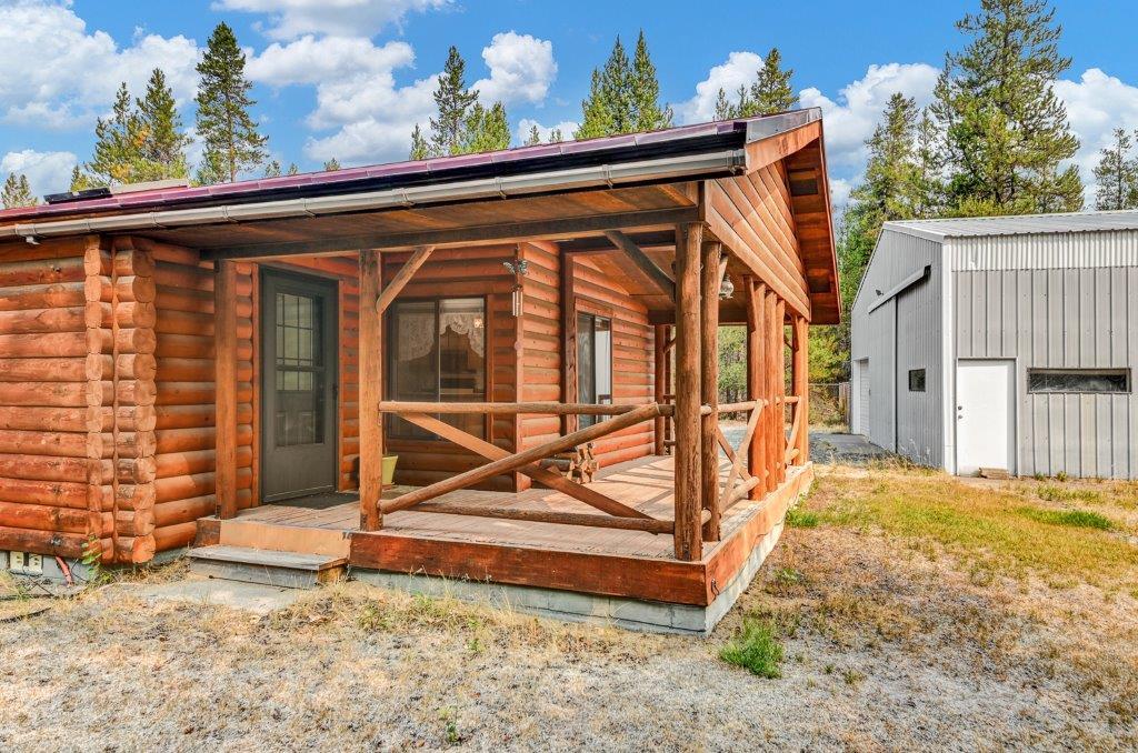 Log Style home with Covered Deck and Large Shop with 3 Doors plus Workshop