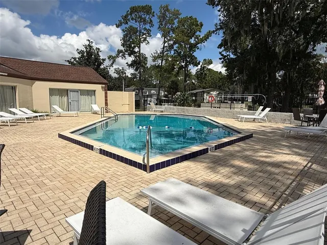 a view of a backyard with pool
