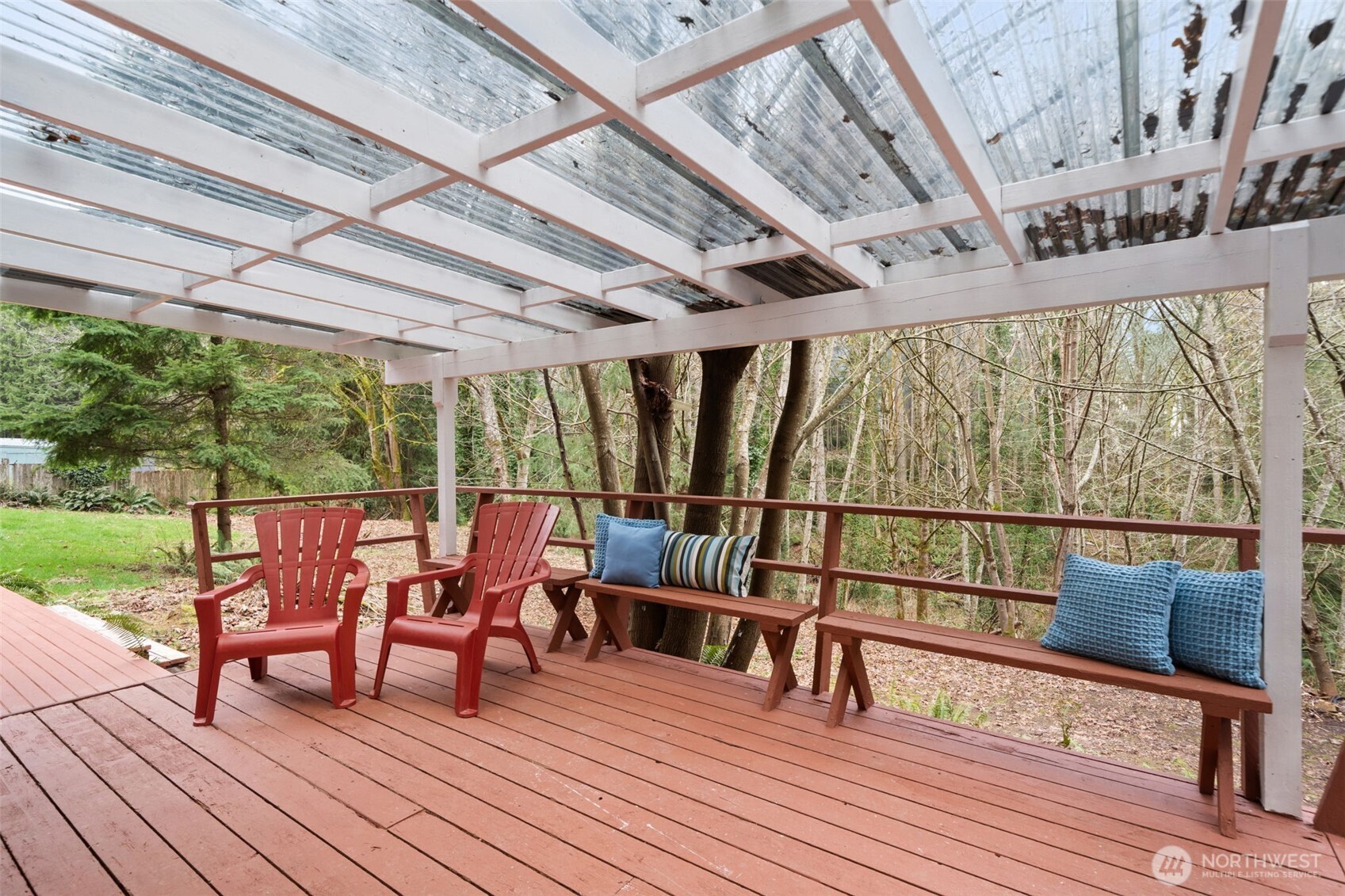 13080 Old Military Road Northeast Poulsbo, WA 98370 - Photo 22 of 29 a balcony with wooden floor outdoor seating and wooden floor