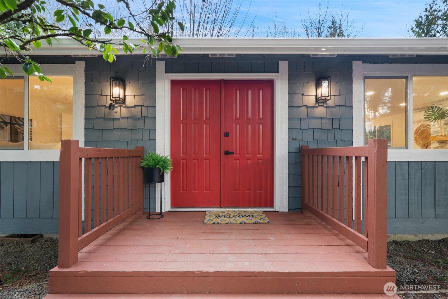 13080 Old Military Road Northeast Poulsbo, WA 98370 - Photo 3 of 29 a view of a house with a porch