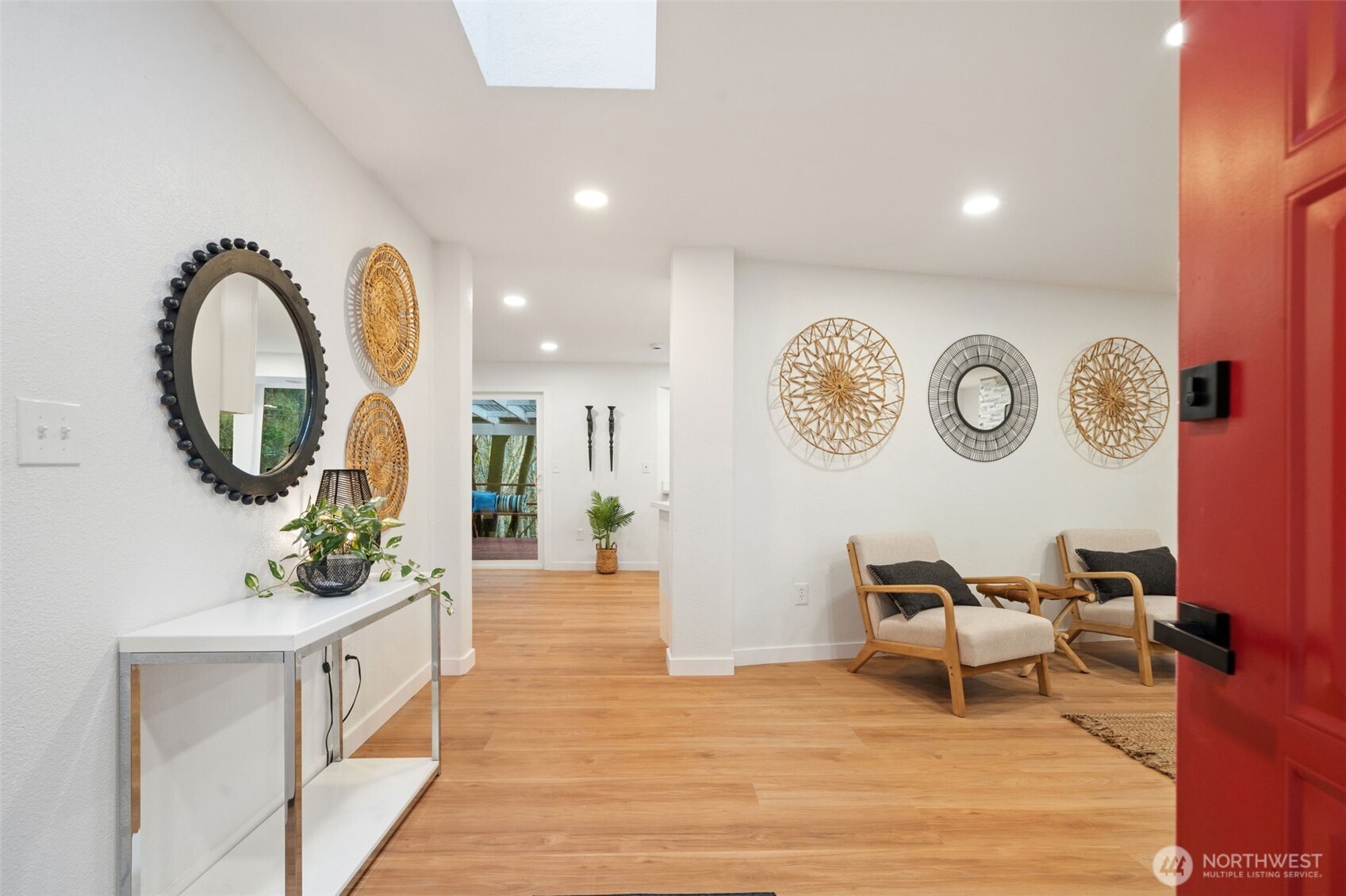 13080 Old Military Road Northeast Poulsbo, WA 98370 - Photo 4 of 29 a living room with chair and a mirror