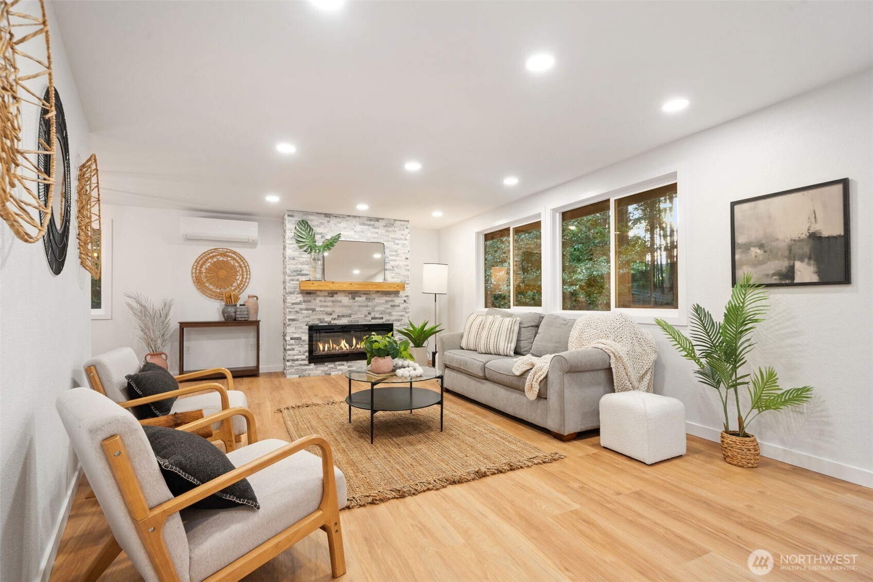 13080 Old Military Road Northeast Poulsbo, WA 98370 - Photo 5 of 29 a living room with fireplace furniture and a large window
