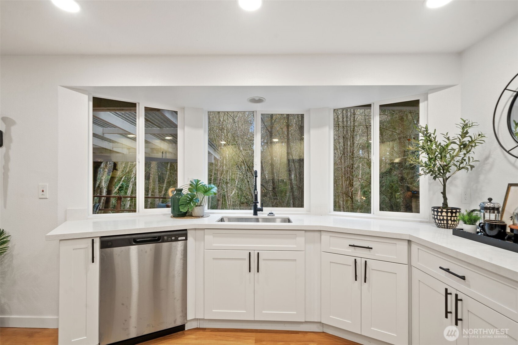13080 Old Military Road Northeast Poulsbo, WA 98370 - Photo 10 of 29 a bathroom with a sink and a large mirror