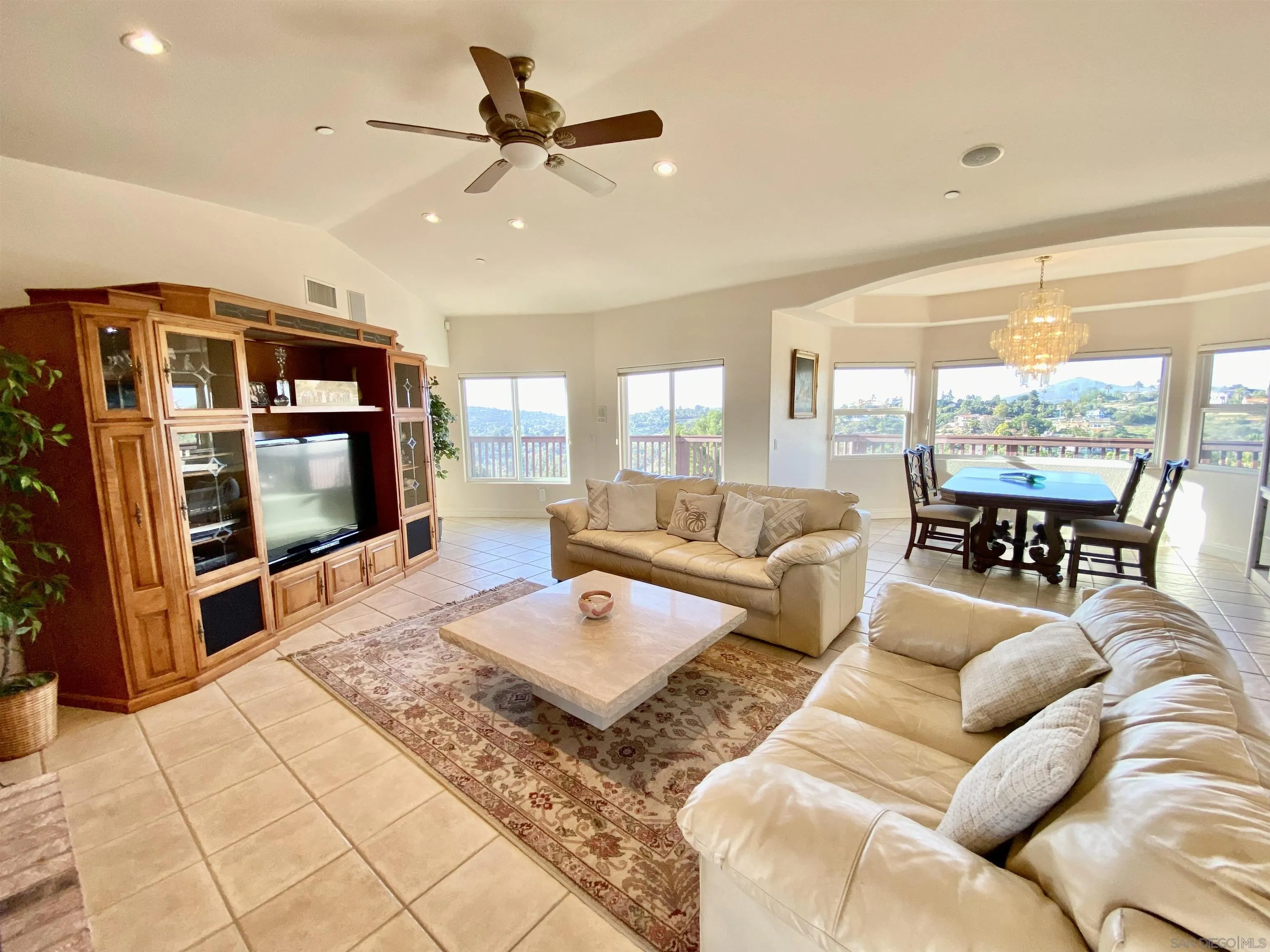 4375 North Rogers Road Spring Valley, CA 91977 - Photo 14 of 34 a living room with furniture and a flat screen tv