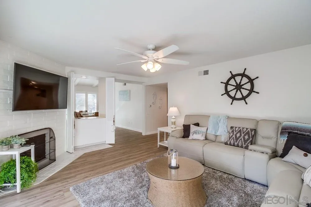 10 GingerTree Lane Coronado, CA 92118 - Photo 14 of 68 a living room with furniture and a flat screen tv