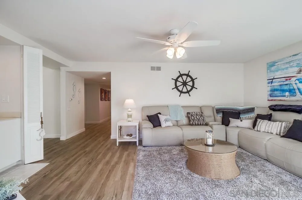 10 GingerTree Lane Coronado, CA 92118 - Photo 15 of 68 a living room with furniture and a large window