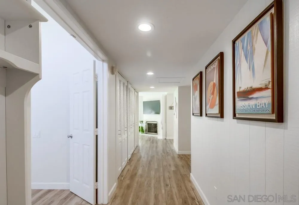 10 GingerTree Lane Coronado, CA 92118 - Photo 29 of 68 a view of a hallway with wooden floor and windows