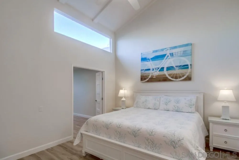 10 GingerTree Lane Coronado, CA 92118 - Photo 31 of 68 a bedroom with a bed and a window