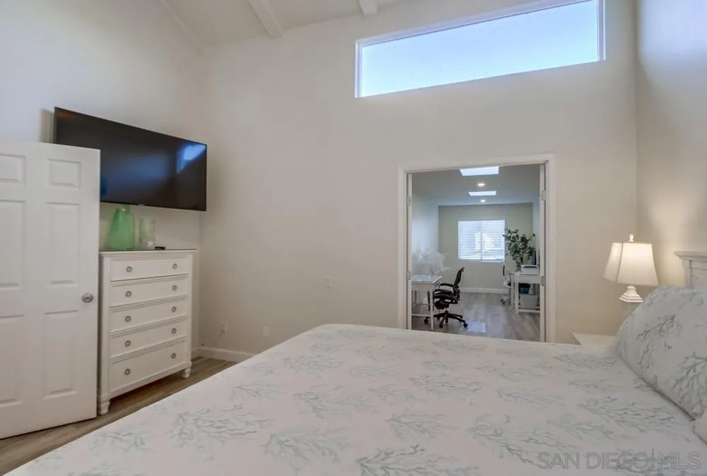 10 GingerTree Lane Coronado, CA 92118 - Photo 32 of 68 a bedroom with a bed and a flat screen tv