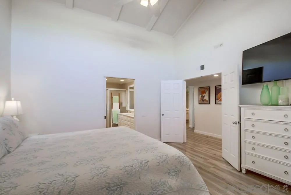 10 GingerTree Lane Coronado, CA 92118 - Photo 33 of 68 a bedroom with a bed and a flat screen tv