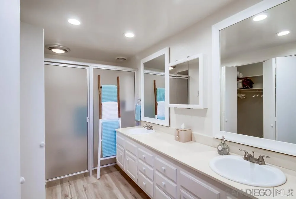 10 GingerTree Lane Coronado, CA 92118 - Photo 38 of 68 a bathroom with a double vanity sink and a mirror
