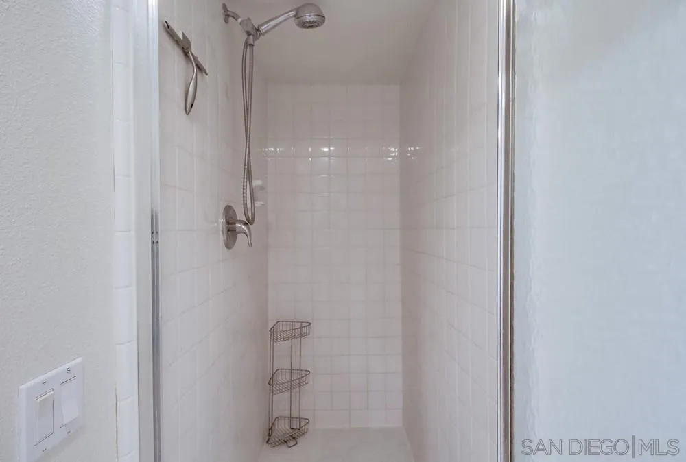 10 GingerTree Lane Coronado, CA 92118 - Photo 40 of 68 a bathroom with a glass shower door