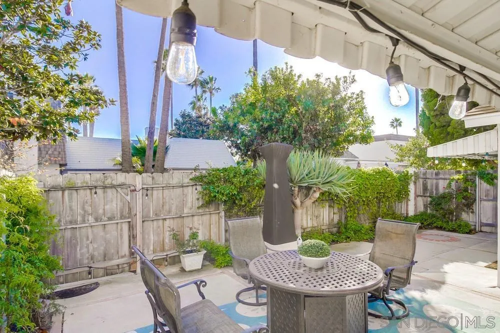 10 GingerTree Lane Coronado, CA 92118 - Photo 48 of 68 a view of a patio with table and chairs potted plants