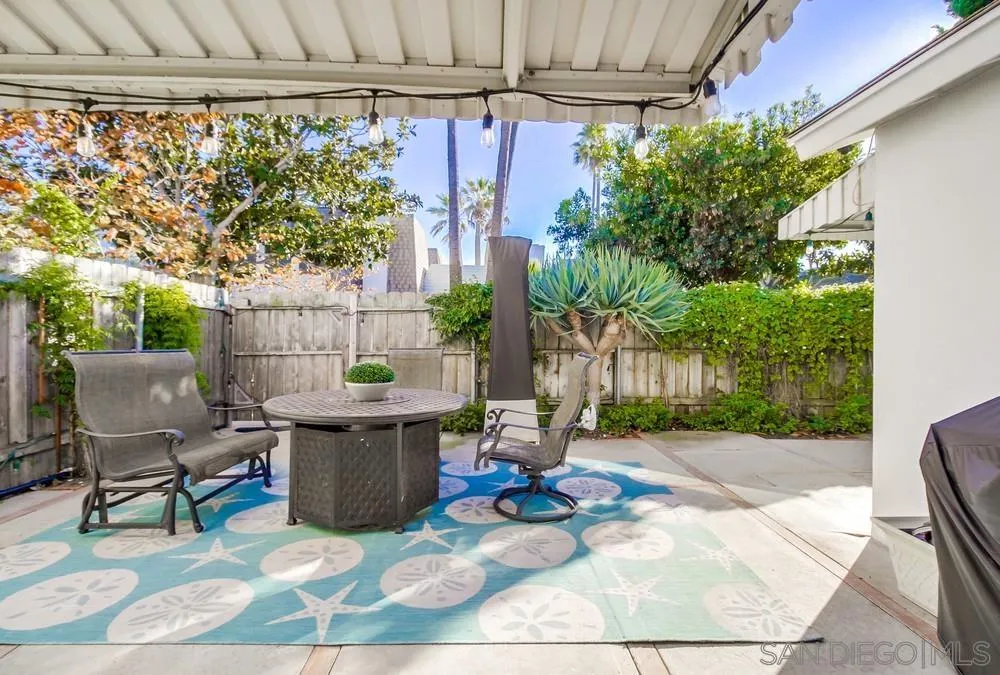 10 GingerTree Lane Coronado, CA 92118 - Photo 49 of 68 a view of a patio with table and chairs potted plants