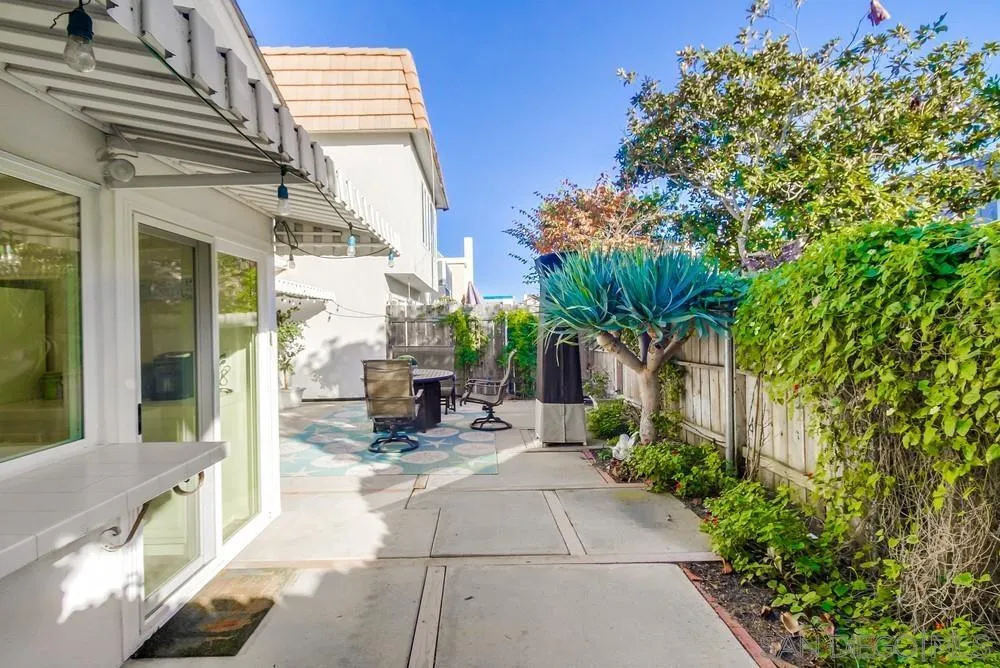 10 GingerTree Lane Coronado, CA 92118 - Photo 54 of 68 a view of a patio with table and chairs and potted plants
