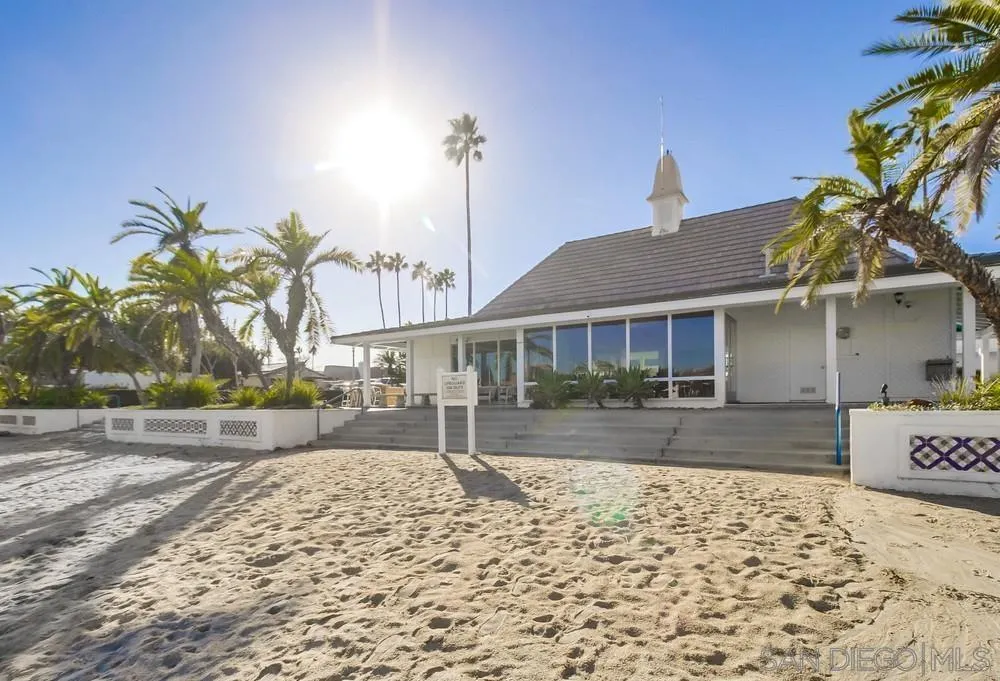 10 GingerTree Lane Coronado, CA 92118 - Photo 66 of 68 a front view of a house with a yard and garage