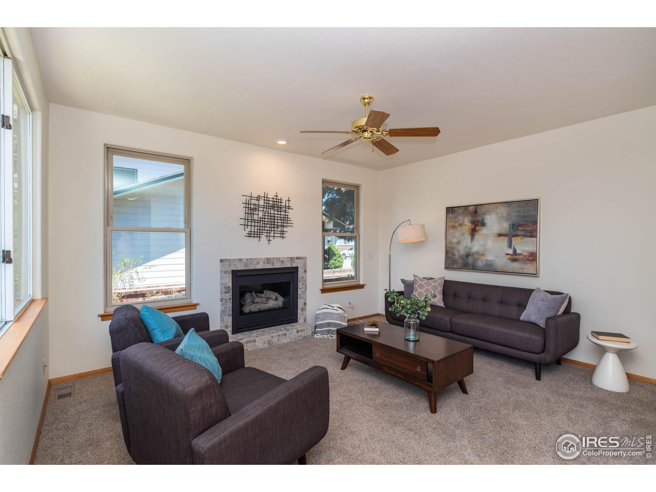 1907 Red Cloud Road Longmont, CO 80504 - Photo 12 of 31 Comfortable family room with newly tiled surround fireplace-gas.