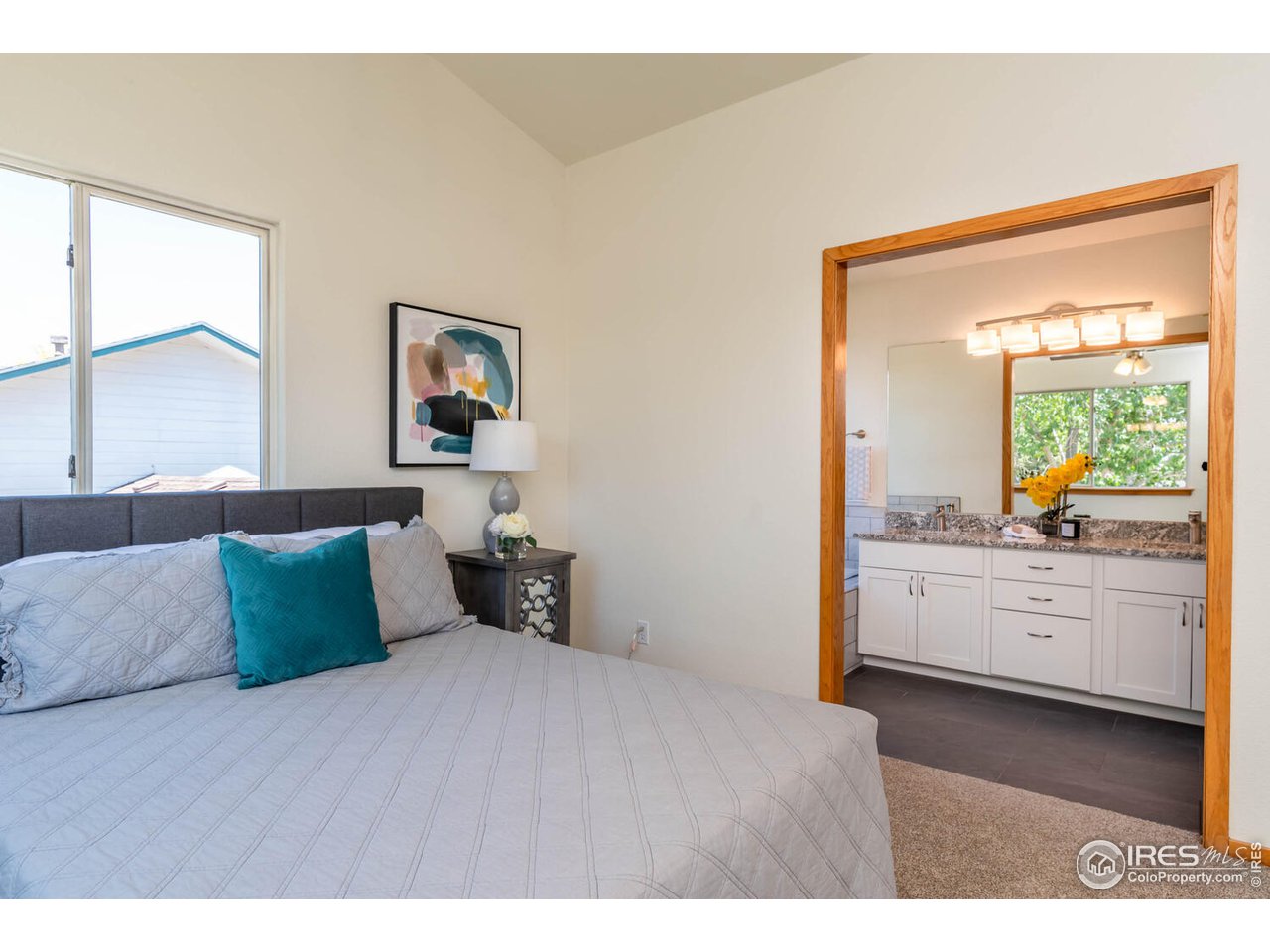 1907 Red Cloud Road Longmont, CO 80504 - Photo 14 of 31 Remodeled 5-piece primary bath with tile and granite.