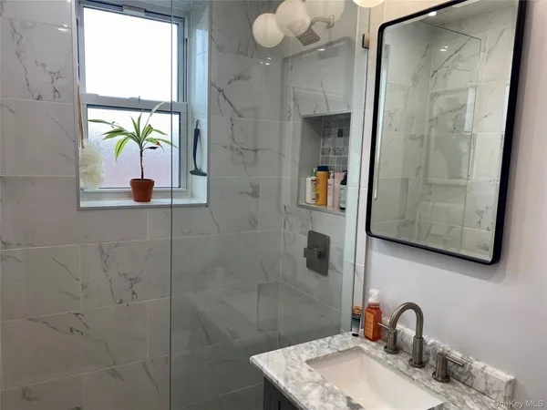 a bathroom with a sink and a mirror