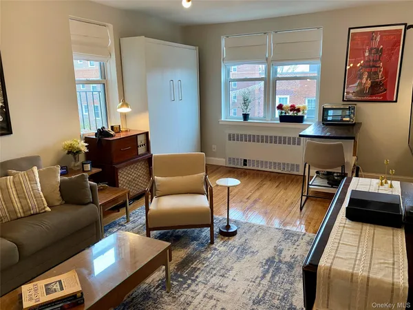 a living room with furniture and a large window