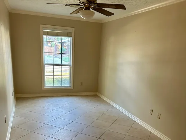 a white toilet sitting next to a bath tub